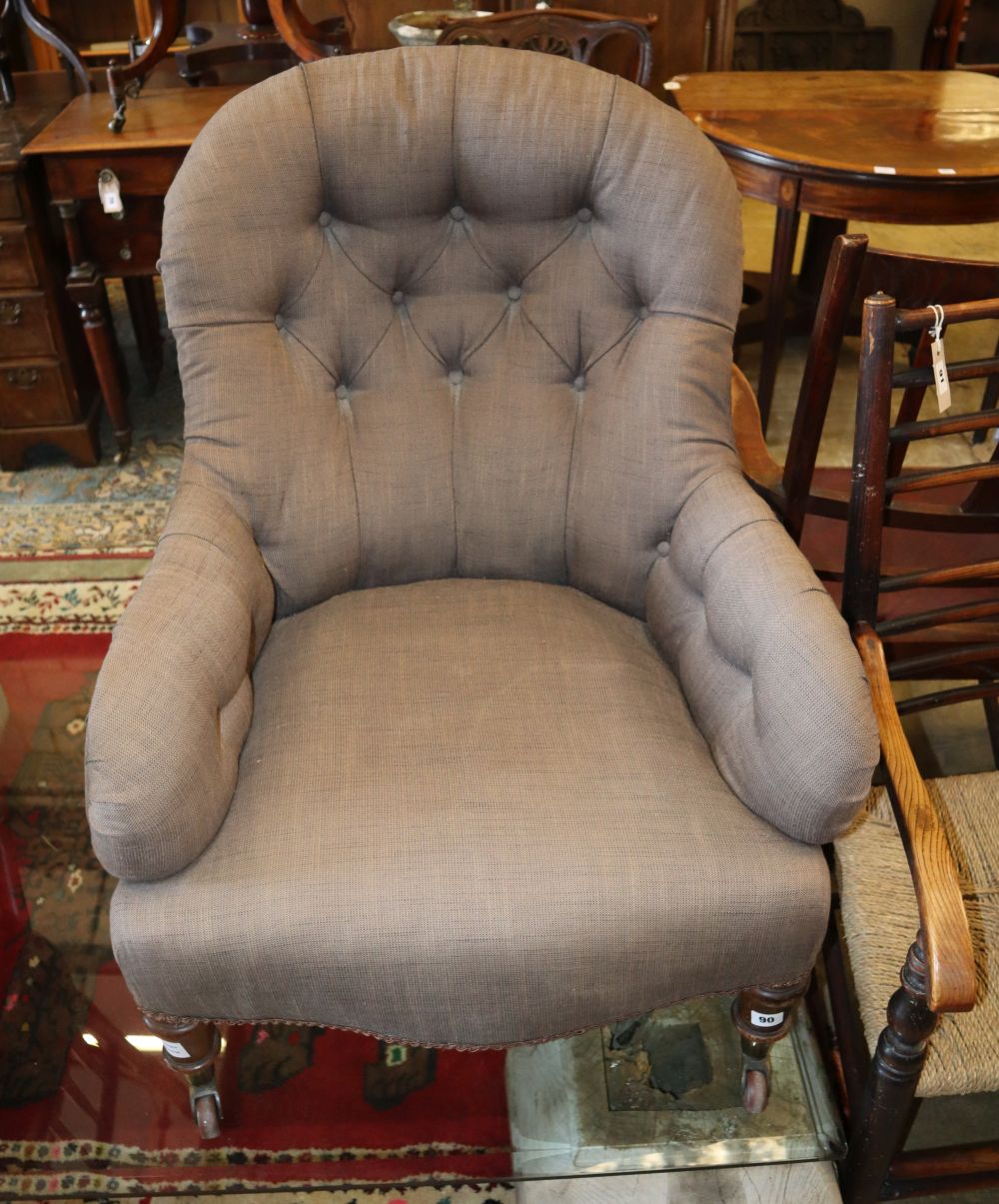 A Victorian upholstered spoonback armchair